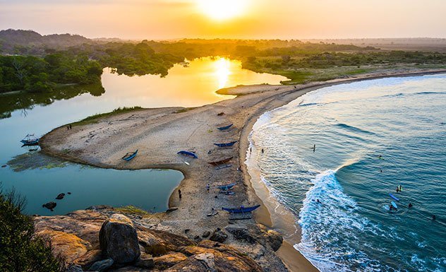 Sunset over the lagoon and surf point at Arugam Bay