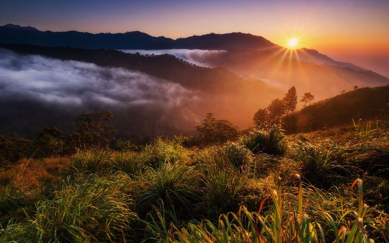 Sunrise over misty hills near Ella