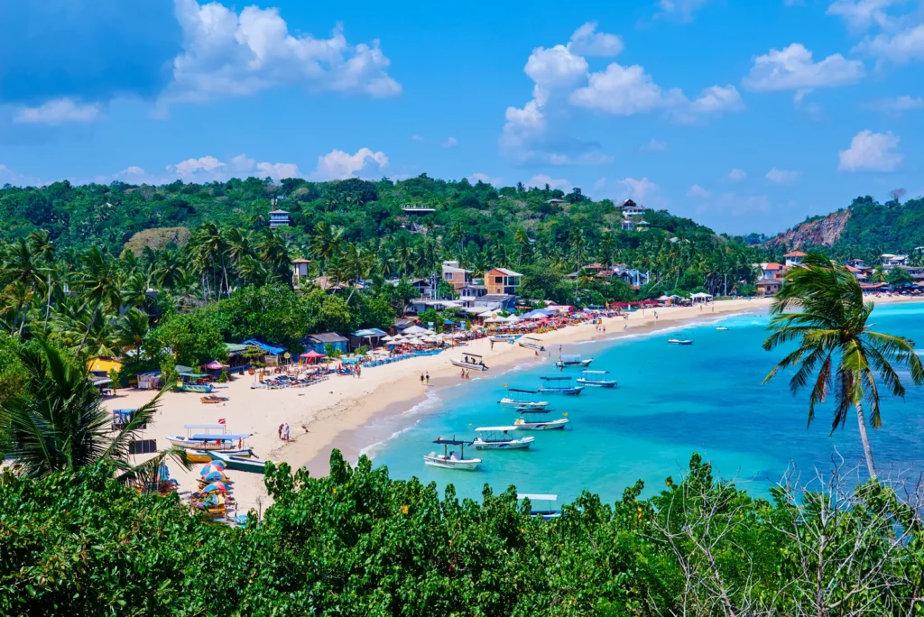 Tropical bay with boats on the coast near Galle