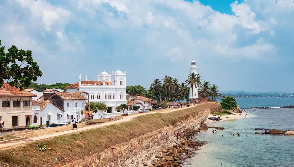 Galle Fort ramparts and lighthouse by the sea